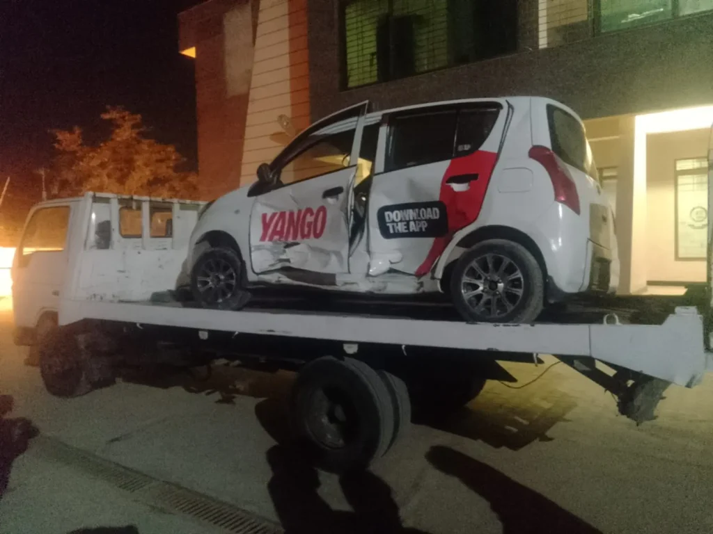 Small car on tow truck after accident